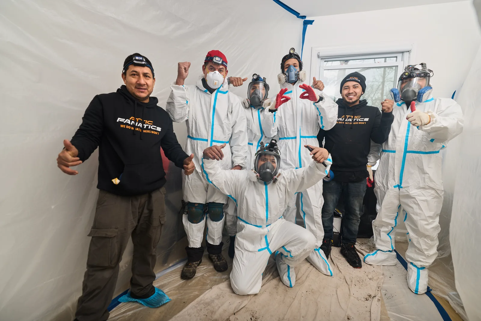 Attic Fanatics crew in hazmat gear